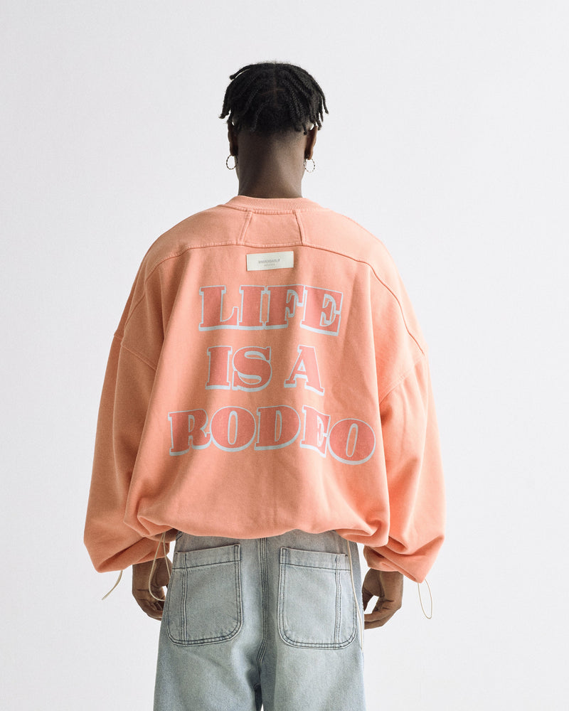 Rodeo "Life is a Rodeo" Crewneck Orange