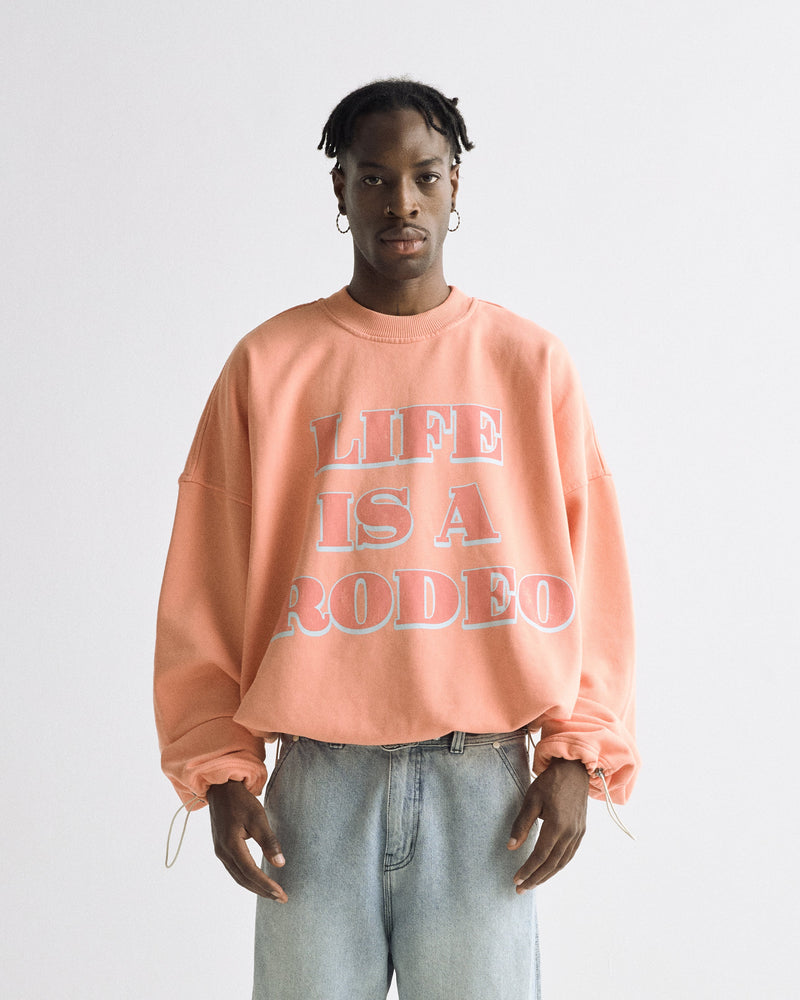 Rodeo "Life is a Rodeo" Crewneck Orange